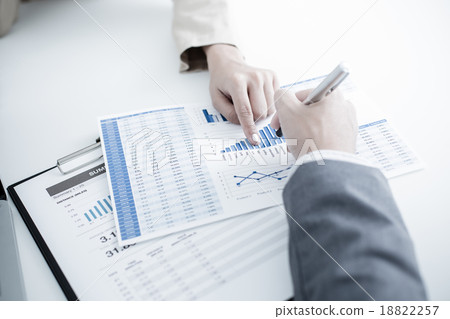 Business people discussing the charts and graphs showing the res 18822257