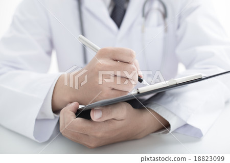 Close-up Of Male Doctor Filling The Medical Form 18823099