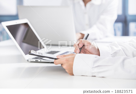 Business people discussing the charts and graphs showing the res 18823571