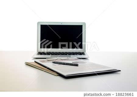 Still-life portrait of computer, pen, coffee mug on table, busin 18823661