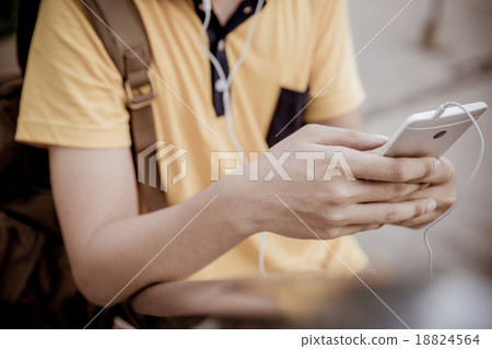 students sitting on stairs with their smartphones students sitting on stairs with their smartphones 18824564