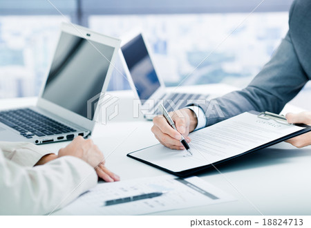 Female hand signing contract. Female hand signing contract. 18824713