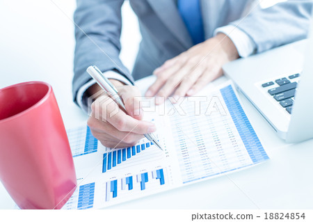 Businessman analyzing investment charts with laptop. Accounting Businessman analyzing investment charts with laptop. Accounting 18824854