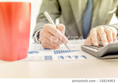 Businessman analyzing investment charts with laptop. Accounting Businessman analyzing investment charts with laptop. Accounting 18824863