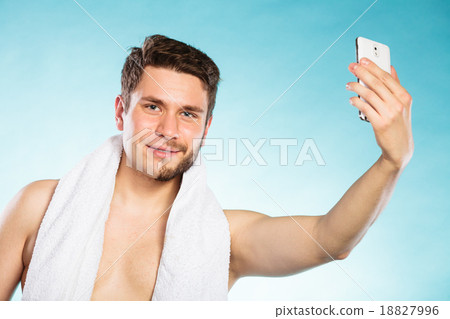 Half shaved man taking selfie self photo. 18827996