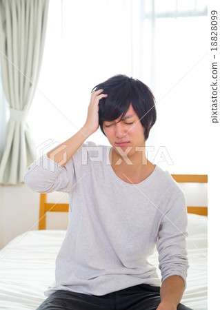 Headache hangover fatigue fatigue tired of sickness poor physical condition of young men in their teens or 20s portrayed Headache hangover fatigue fatigue tired of sickness poor physical condition of young men in their teens or 20s portrayed 18828099