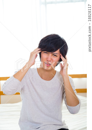 Headache hangover fatigue fatigue tired of sickness poor physical condition of young men in their teens or 20s portrayed 18828117