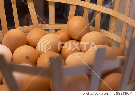 Basket full of white and brown eggs Basket full of white and brown eggs 18828967