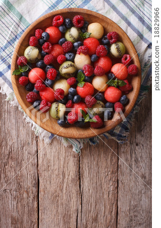 salad of fresh fruit and berries vertical top view salad of fresh fruit and berries vertical top view 18829966