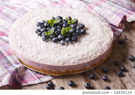 cheesecake with blueberries and mint close-up cheesecake with blueberries and mint close-up 18830124