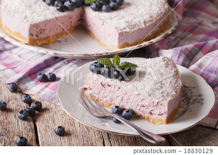 blueberry cheesecake with coconut and mint closeup blueberry cheesecake with coconut and mint closeup 18830129