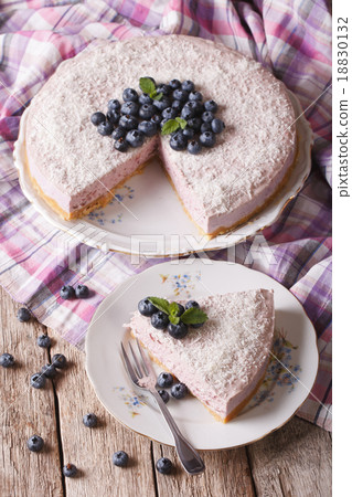 Cut a piece of blueberry cheesecake close-up 18830132