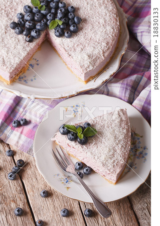 Sliced blueberry cheesecake with coconut closeup 18830133