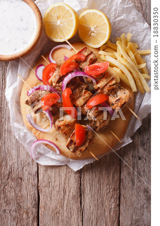 Greek souvlaki with vegetables and french fries Greek souvlaki with vegetables and french fries 18830350