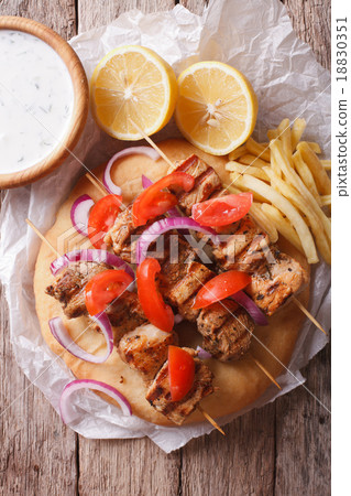 Greek souvlaki with vegetables and french fries 18830351