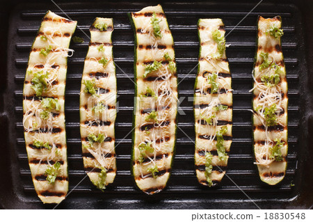 grilled zucchini with cheese on the grill close up grilled zucchini with cheese on the grill close up 18830548