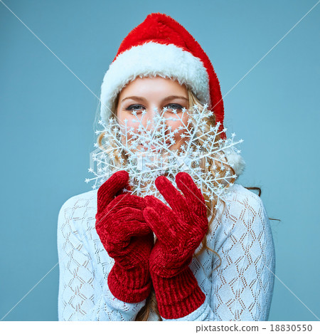 Beautiful young woman in Santa Claus clothes with Beautiful young woman in Santa Claus clothes with 18830550