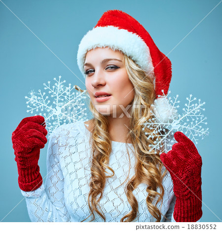 Beautiful young woman in Santa Claus clothes with Beautiful young woman in Santa Claus clothes with 18830552