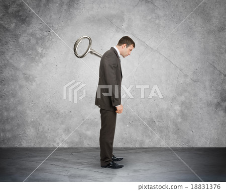 Businessman with key in back Businessman with key in back 18831376