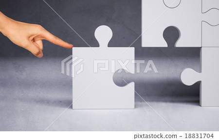 Man hand pushing puzzle piece Man hand pushing puzzle piece 18831704