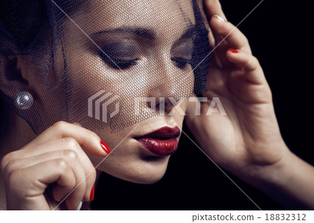 beauty brunette woman under black veil with red 18832312