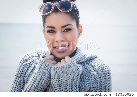 Attractive woman wearing a warm cardigan 18836020