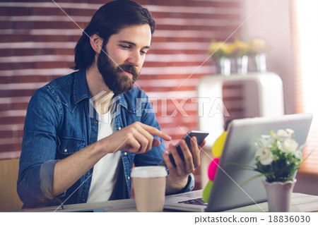 Confident creative businessman using smartphone 18836030