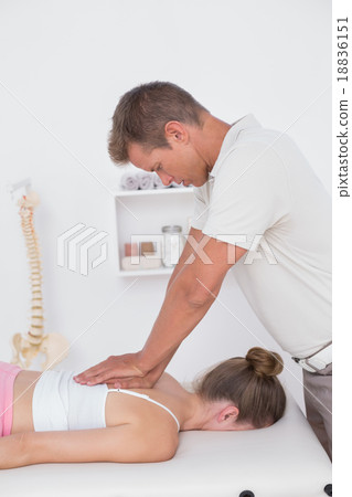 Physiotherapist doing back massage Physiotherapist doing back massage 18836151