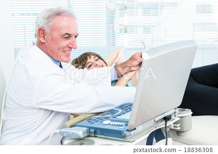 Doctor doing ultrasound test on pregnant woman 18836308