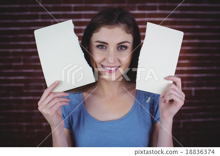 Pretty brunette holding two pages 18836374