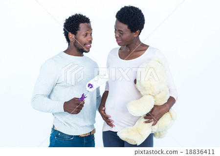 Wife holding teddy bear and looking at man holding roller Wife holding teddy bear and looking at man holding roller 18836411