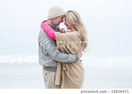 Cute couple standing and holding each other Cute couple standing and holding each other 18836471