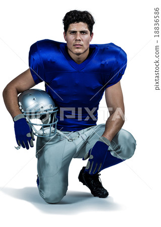 Portrait of confident American football player holding helmet Portrait of confident American football player holding helmet 18836586