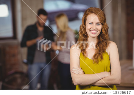 Portrait of smiling beautiful woman with arms crossed Portrait of smiling beautiful woman with arms crossed 18836617