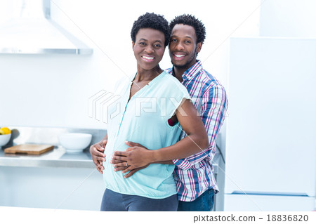 Portrait of man embracing his wife while standing Portrait of man embracing his wife while standing 18836820