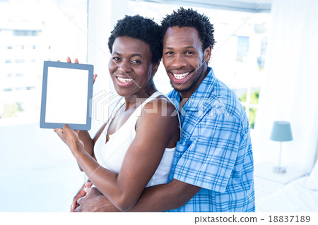 Portrait of happy couple embracing 18837189