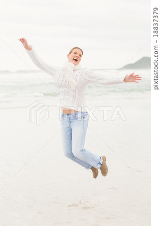 Woman jumping into the air 18837379