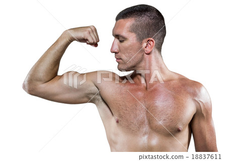 Confident shirtless athlete flexing muscles 18837611