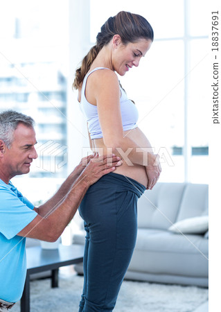 Pregnant woman getting massage Pregnant woman getting massage 18837691