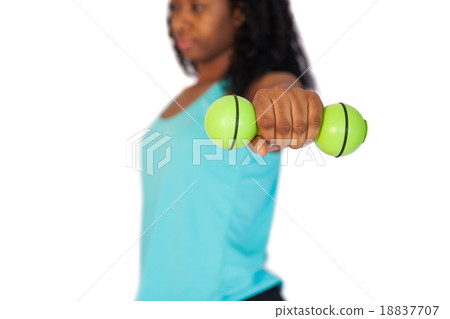Woman exercising using dumbbells Woman exercising using dumbbells 18837707