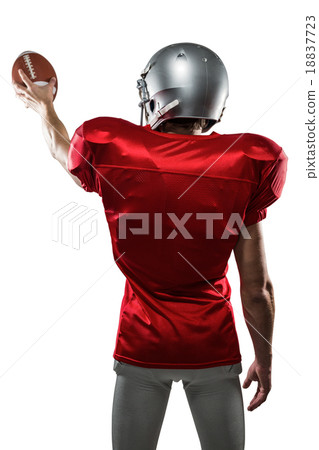 Rear view of sport player in red jersey holding ball Rear view of sport player in red jersey holding ball 18837723