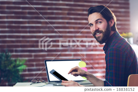Portrait of smiling creative businessman using digital tablet Portrait of smiling creative businessman using digital tablet 18838152