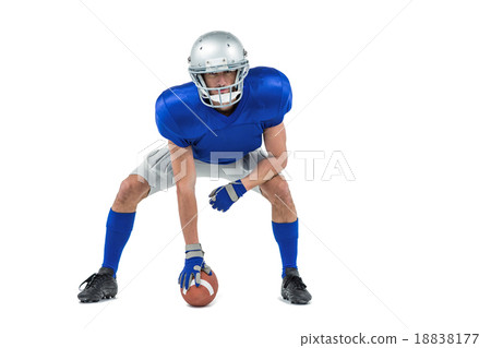 Alert American football player in attack stance 18838177