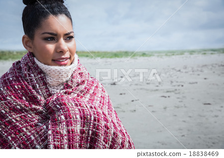 Beautiful woman wrapped up in warm clothing 18838469