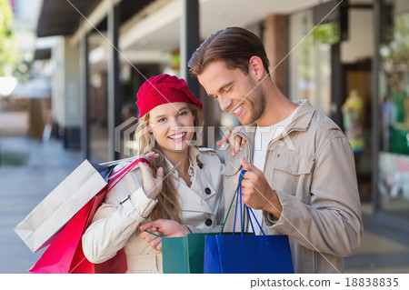 A happy couple looking inside a bag 18838835