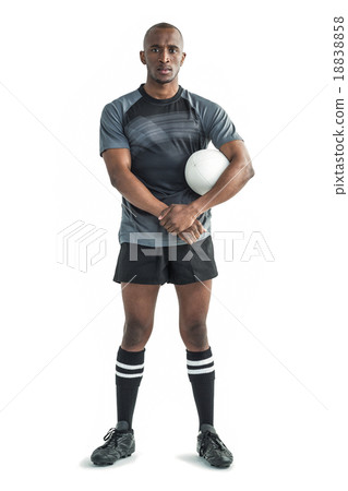 Portrait of confident rugby player standing 18838858