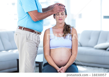 Therapist massaging pregnant woman Therapist massaging pregnant woman 18838957
