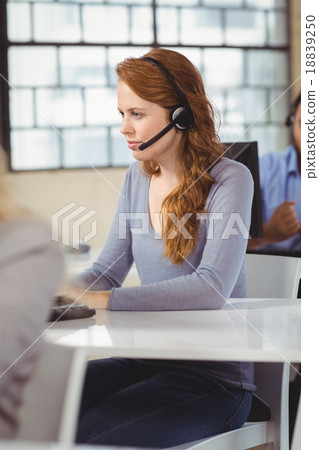 Concentrated female operator in office 18839250