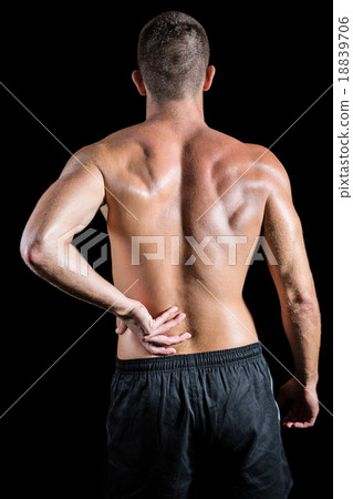 Shirtless athlete with back pain 18839706