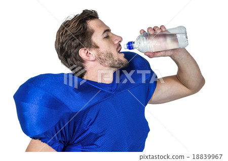American football player drinking water American football player drinking water 18839967